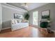Bedroom featuring a vaulted ceiling, daybed, and modern artwork at 303 Roswell Green Ln, Roswell, GA 30075