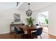 Stylish dining area with elegant lighting, seamlessly connected to the living space at 303 Roswell Green Ln, Roswell, GA 30075