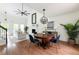 Stylish dining area with elegant lighting, seamlessly connected to the living space at 303 Roswell Green Ln, Roswell, GA 30075
