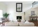 Bright living room featuring a fireplace, vaulted ceilings, and hardwood floors at 303 Roswell Green Ln, Roswell, GA 30075