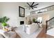 Bright living room featuring a fireplace, vaulted ceilings, and hardwood floors at 303 Roswell Green Ln, Roswell, GA 30075
