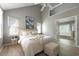 Bright main bedroom featuring a vaulted ceiling and an ensuite bathroom at 303 Roswell Green Ln, Roswell, GA 30075