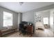 A well-lit home office leads into the neutral toned main bedroom at 303 Roswell Green Ln, Roswell, GA 30075