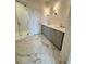 Bathroom featuring tiled floors, a glass shower door, and a double vanity at 435 Chiswick Cir # 21, Alpharetta, GA 30009