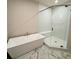 Bathroom featuring tiled floors, a glass shower door, and a standalone tub at 435 Chiswick Cir # 21, Alpharetta, GA 30009