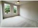 Bright bedroom featuring large windows and ceiling fan at 435 Chiswick Cir # 21, Alpharetta, GA 30009