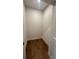 This walk-in closet features hardwood floors and white trim at 435 Chiswick Cir # 21, Alpharetta, GA 30009