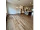 Spacious dining area with hardwood floors, modern lighting, and open access to the kitchen at 435 Chiswick Cir # 21, Alpharetta, GA 30009