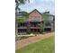 Exterior view of new brick townhome with balconies and manicured lawn at 435 Chiswick Cir # 21, Alpharetta, GA 30009