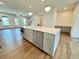 Kitchen island with light grey cabinets, stainless dishwasher and microwave at 435 Chiswick Cir # 21, Alpharetta, GA 30009