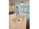 Close up of kitchen sink with marble countertop and faucet at 435 Chiswick Cir # 21, Alpharetta, GA 30009