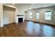 This spacious living room features a fireplace, hardwood floors, and natural light at 435 Chiswick Cir # 21, Alpharetta, GA 30009