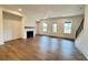 This spacious living room features a fireplace, hardwood floors, and natural light at 435 Chiswick Cir # 21, Alpharetta, GA 30009