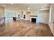 Open-concept living space showcasing hardwood floors, fireplace, kitchen and natural light at 435 Chiswick Cir # 21, Alpharetta, GA 30009