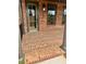 Brick porch on townhome with olive-green door at 435 Chiswick Cir # 21, Alpharetta, GA 30009