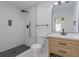 Modern bathroom featuring a walk-in shower with black fixtures and stylish wood vanity at 5207 Dixie Lake Rd, Union City, GA 30291