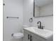 Elegant bathroom with white fixtures and a sleek vanity with black hardware at 5207 Dixie Lake Rd, Union City, GA 30291