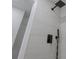 Close up of a sleek shower with a rainfall showerhead and a handheld sprayer at 5207 Dixie Lake Rd, Union City, GA 30291