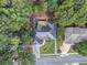 Overhead shot displaying home with landscaped yard, and deck at 569 Fairway Dr, Woodstock, GA 30189