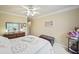 Inviting bedroom with a ceiling fan, a chest by the bed, and a peaceful ambiance at 569 Fairway Dr, Woodstock, GA 30189