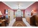 Cozy bedroom with a ceiling fan, large windows, and elegant wood trim at 569 Fairway Dr, Woodstock, GA 30189