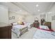 Spacious bedroom with 3 beds, soft neutral walls, and recessed lighting at 569 Fairway Dr, Woodstock, GA 30189