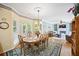 An eat-in kitchen open to the Gathering room, with hardwood floors and plenty of natural light at 569 Fairway Dr, Woodstock, GA 30189