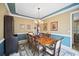 Traditional dining room with natural light, an antique hutch, and seating for eight at 569 Fairway Dr, Woodstock, GA 30189