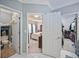 A hallway leading to the main bedroom, main bathroom, and closet at 569 Fairway Dr, Woodstock, GA 30189