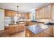 A spacious kitchen with stainless steel appliances, granite countertops, and a center island for meal preparation at 569 Fairway Dr, Woodstock, GA 30189