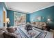 Cozy living room with a large window, plush sofas, and decorative accents at 569 Fairway Dr, Woodstock, GA 30189