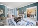 Cozy living area with hardwood floors, a large window view and easy access to the dining room at 569 Fairway Dr, Woodstock, GA 30189