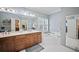 A spacious main bathroom with a double vanity, a jetted tub, and plenty of storage at 569 Fairway Dr, Woodstock, GA 30189