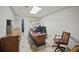 Functional home office with desk, chair, and ample storage cabinets at 569 Fairway Dr, Woodstock, GA 30189