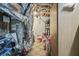 Basement utility room with exposed ductwork, water heater, and tiled floor at 569 Fairway Dr, Woodstock, GA 30189