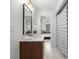 Bathroom with modern vanity, hexagonal tile flooring, and a view of the bedroom through the doorway at 1494 May Se Ave, Atlanta, GA 30316