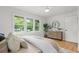 Bright bedroom with hardwood floors and a large window offering a view of the outdoors at 1494 May Se Ave, Atlanta, GA 30316