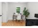 Cozy bedroom with a dedicated desk area, natural light from the window, and hardwood floors at 1494 May Se Ave, Atlanta, GA 30316