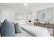 Tastefully decorated bedroom with neutral colors and a statement art piece above the console at 1494 May Se Ave, Atlanta, GA 30316