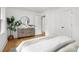 Spacious bedroom with hardwood floors, neutral colors, dresser, and ample natural light at 1494 May Se Ave, Atlanta, GA 30316