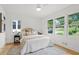 Bedroom with hardwood floors and three large windows providing an abundance of natural light at 1494 May Se Ave, Atlanta, GA 30316
