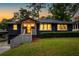 Charming exterior with brick, manicured bushes, and light gray stairs leading to the front door at 1494 May Se Ave, Atlanta, GA 30316