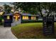 Beautiful craftsman home featuring a dark gray paint, wooden shingles, and a well manicured lawn at 1494 May Se Ave, Atlanta, GA 30316