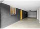Spacious garage with gray brick walls, a window, and an overhead door for convenient parking at 1494 May Se Ave, Atlanta, GA 30316