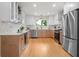 Stylish kitchen boasting stainless steel appliances, two-tone cabinetry, and bright lighting at 1494 May Se Ave, Atlanta, GA 30316