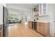Spacious kitchen flows into living area with stainless appliances and two-tone custom cabinets at 1494 May Se Ave, Atlanta, GA 30316