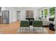Open-concept living room with stainless steel appliances and natural light from the windows at 1494 May Se Ave, Atlanta, GA 30316
