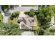 Aerial view of the property showcasing the home's layout, landscaping, and outdoor living spaces in a well-maintained setting at 157 Lake Forrest Ne Ln, Atlanta, GA 30342