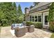 Relaxing backyard patio with a comfortable seating area and lush green surroundings, ideal for outdoor entertaining at 157 Lake Forrest Ne Ln, Atlanta, GA 30342