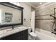 Bathroom with tile surround tub and shower combination at 157 Lake Forrest Ne Ln, Atlanta, GA 30342